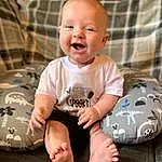 Skin, Smile, Facial Expression, Baby & Toddler Clothing, Sleeve, Flash Photography, Baby, Comfort, Happy, Toddler, T-shirt, Fun, Child, Sitting, Foot, Barefoot, Person
