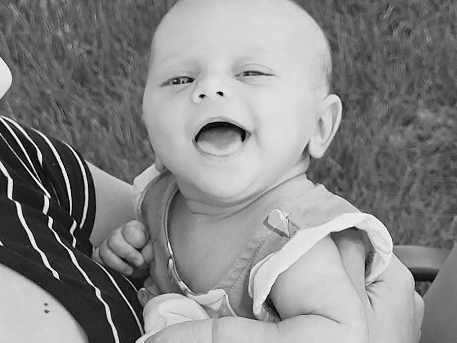 Hand, Photograph, White, Smile, Black, Baby & Toddler Clothing, Flash Photography, Sleeve, Black-and-white, Happy, Gesture, Style, Baby, Finger, People In Nature, Grass, Toddler, People, Person