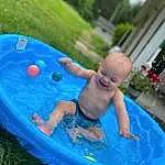 Water, Green, Leisure, Fun, Aqua, Summer, Toddler, Grass, Recreation, Baby, Bathing, Smile, Child, Inflatable, Games, Play, Swimwear, Electric Blue, Circle, Plant, Person, Joy