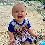 Face, Skin, Smile, Head, Eyes, Blue, Baby & Toddler Clothing, Wood, Grass, Toddler, Happy, Baby, Leisure, Fun, Child, Pattern, Foot, Sitting, Person
