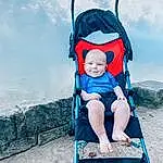 Wheel, Azure, Cloud, People In Nature, Toddler, Baby & Toddler Clothing, Recreation, Happy, Tire, Electric Blue, Leisure, Baby Carriage, Baby, Fun, Comfort, Travel, Sitting, Child, Baby Products, Sky, Person, Joy