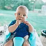 Face, Skin, Photograph, Azure, Baby & Toddler Clothing, Happy, Sleeve, Flash Photography, Toddler, Aqua, Baby, Leisure, Summer, Electric Blue, Grass, Sitting, Thigh, Child, Recreation, Fun, Person