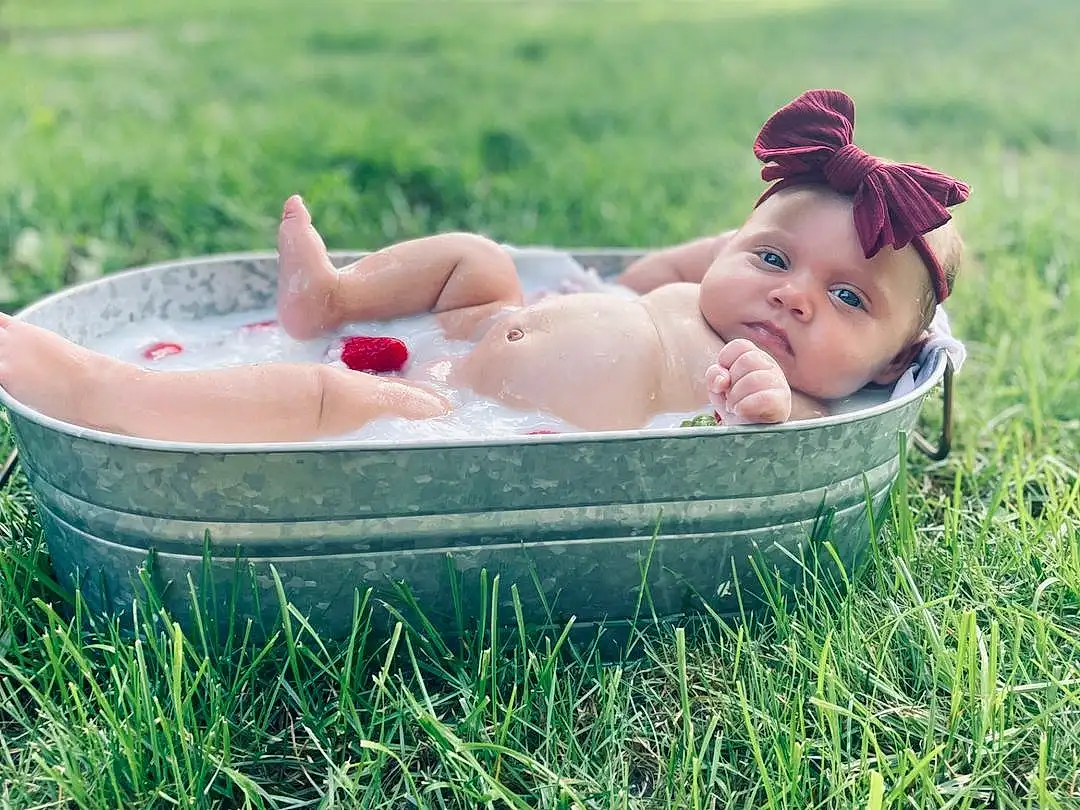 Plant, People In Nature, Baby, Happy, Hat, Baby & Toddler Clothing, Comfort, Grass, Leisure, Toddler, Recreation, Meadow, Lawn, Fun, Bathing, Child, Event, Sitting, Person, Headwear