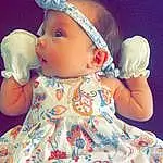 Nose, Face, Cheek, Skin, Head, Lip, Chin, Hand, Hairstyle, Arm, Eyes, Facial Expression, Dress, Baby & Toddler Clothing, Human Body, Fashion, Neck, Person, Headwear