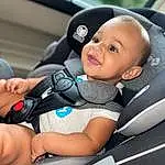 Automotive Design, Comfort, Vroom Vroom, Baby Carriage, Baby, Car Seat, Toddler, Auto Part, Baby Products, Baby & Toddler Clothing, Child, Baby In Car Seat, Baby Safety, Smile, Sitting, Luxury Vehicle, Vehicle Door, Head Restraint, Electric Blue, Automotive Exterior, Person