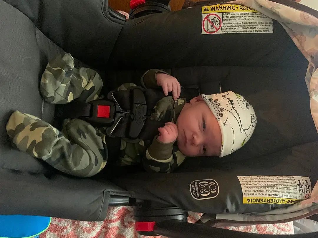 Human Body, Comfort, Baby, Helmet, Toddler, Personal Protective Equipment, Child, Car Seat, Baby Products, Military Uniform, Baby & Toddler Clothing, Auto Part, Military Person, Military Camouflage, Sports Gear, Carmine, Cap, Baby Carriage, Soldier, Uniform, Person, Headwear