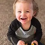 Face, Smile, Skin, Hand, Flash Photography, Wheel, Orange, Happy, Baby & Toddler Clothing, Wood, Toddler, Tire, Grass, Tree, Toy, Child, Baby, Fun, Sitting, People In Nature, Person, Joy