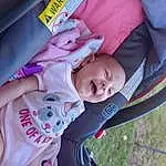 Face, Cheek, Skin, Comfort, Baby, Tree, Pink, Toddler, Baby Carriage, Happy, Baby & Toddler Clothing, Beauty, Plant, Child, Grass, Fun, Baby Products, Car Seat, Magenta, Leisure, Person