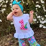 Smile, Plant, Photograph, People In Nature, Leaf, Baby & Toddler Clothing, Sleeve, Happy, Grass, Pink, Toddler, Child, Pattern, Baby, Magenta, Electric Blue, Cap, Tree, Fashion Accessory, Spring, Person, Headwear