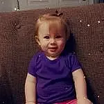 Face, Cheek, Joint, Skin, Head, Hairstyle, Eyes, Facial Expression, Leg, Purple, Smile, Baby & Toddler Clothing, Sleeve, Standing, Iris, Pink, Finger, Person