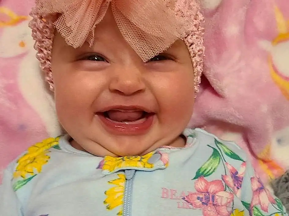Cheek, Smile, Skin, Facial Expression, Textile, Sleeve, Happy, Dress, Baby & Toddler Clothing, Pink, Headgear, Toddler, Child, Fun, Event, Baby, Baby Products, Headpiece, Fashion Accessory, Peach, Person, Headwear