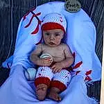 Baby & Toddler Clothing, Baby, Pink, Toddler, Comfort, Baby Sleeping, Cap, Shorts, Lap, Hat, Baby Products, Linens, Carmine, T-shirt, Sitting, Font, Pattern, Foot, Photo Caption, Knit Cap, Person, Headwear