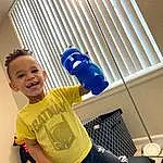 Smile, Standing, Yellow, Happy, Toddler, Electric Blue, Leisure, Ceiling, T-shirt, Comfort, Design, Human Leg, Child, Room, Knee, Fun, Sitting, Shorts, Person, Joy