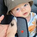 Skin, Facial Expression, White, Smile, Cap, Sleeve, Baby & Toddler Clothing, Gesture, Hat, Headgear, Cool, Toddler, Sun Hat, Child, Baby, Happy, Pattern, Beauty, Baseball Cap, Elbow
