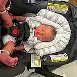 Hand, Comfort, Baby, Baby Carriage, Finger, Toddler, Watch, Baby & Toddler Clothing, Baby Products, Service, Child, Auto Part, Car Seat, Thumb, Carmine, Baby Safety, Lap, Sitting, Personal Protective Equipment, Person