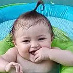 Nose, Cheek, Skin, Chin, Eyebrow, Smile, Green, Happy, Iris, Gesture, Baby, Toddler, Baby & Toddler Clothing, Grass, Fun, Leisure, Child, Baby Products, Bathing, People In Nature, Person