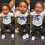 Face, Hair, Cheek, Head, Skin, Shorts, Hairstyle, Blue, Baby & Toddler Clothing, Happy, Sleeve, Standing, Gesture, Smile, Cool, Toddler, Friendship, Sportswear, T-shirt, Electric Blue, Person
