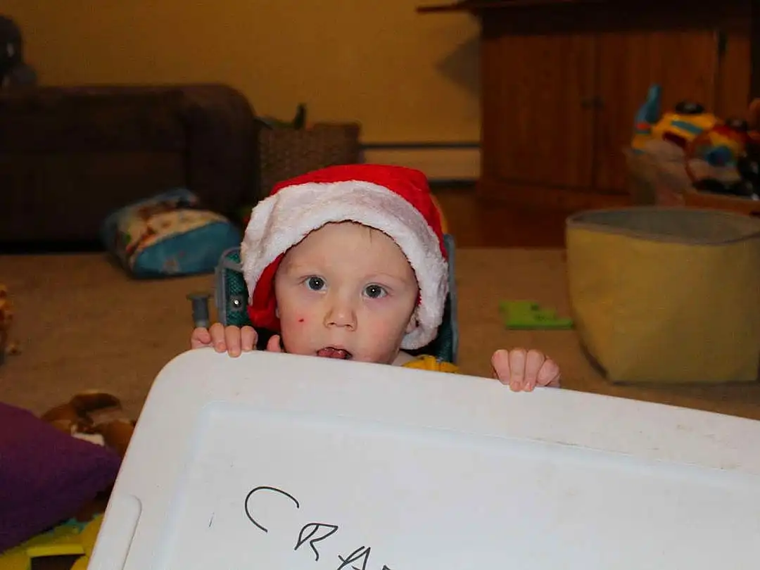 Handwriting, Couch, Toddler, Baby, Event, Chair, Room, Sitting, Comfort, Fun, Child, Carmine, Holiday, Christmas Eve, Wood, Living Room, Christmas, Lap, Person, Surprise, Headwear