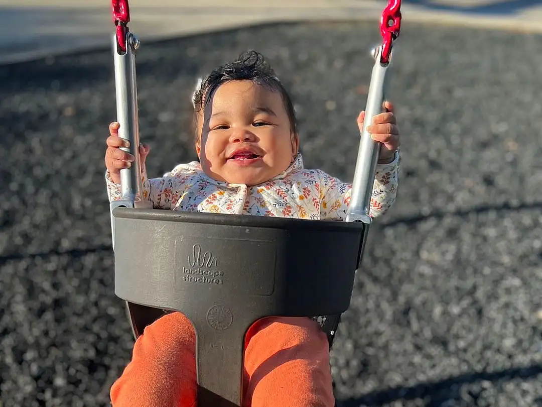Smile, Eyes, Facial Expression, Sleeve, Orange, Happy, People In Nature, Swing, Public Space, Fun, Flash Photography, Grass, Toddler, Red, Baby, Playground, Leisure, Child, T-shirt, Person, Joy