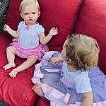 Skin, Head, Hairstyle, Arm, Leg, Dress, Purple, Baby & Toddler Clothing, Human Body, Comfort, Sleeve, Gesture, Pink, Happy, Lap, Toddler, Thigh, Finger, Fun, Sock, Person, Sorrow
