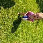Plant, People In Nature, Happy, Grass, Baby, Grassland, Groundcover, Shrub, Meadow, Leisure, Fun, Lawn, Recreation, Toddler, Tree, Landscape, Pasture, Garden, Shadow, Person, Surprise