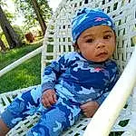 Azure, Leisure, Plant, Toddler, Recreation, Tree, Comfort, Child, Fun, Grass, Baby, Shorts, Electric Blue, Outdoor Play Equipment, Sitting, Hat, Baby Products, Vacation, Pattern, Person, Headwear