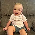 Cheek, Skin, Joint, Smile, Baby & Toddler Clothing, Happy, Finger, Comfort, Thigh, Knee, Child, Flash Photography, Baby, Toddler, Human Leg, Fun, Sitting, Lap, Foot, Person