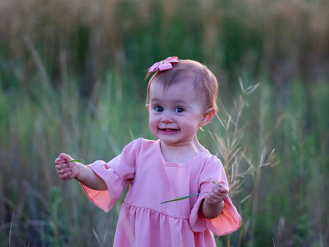 Plant, Eyes, Smile, People In Nature, Sleeve, Happy, Grass, Pink, Grassland, Toddler, Meadow, Baby & Toddler Clothing, Natural Landscape, Prairie, Child, Landscape, Magenta, Wood, Fun, Hat, Person, Joy