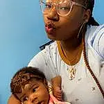 Nose, Face, Cheek, Skin, Lip, Mouth, Eyelash, Gesture, Happy, Child, Toddler, Eyewear, Earrings, Hearing, Jewellery, Cornrows, Fun, Event, Service, Baby, Person