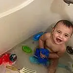 Smile, Bathtub, Baby Bathing, Fluid, Water, Bathroom, Personal Care, Bathing, Toddler, Fun, Baby, Plumbing Fixture, Child, Plumbing, Leisure, Bath Toy, Play, Happy, Room, Baby Products, Person