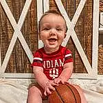 Smile, Head, Basketball, Eyes, Sports Equipment, White, Wood, Baby & Toddler Clothing, Happy, Shorts, Ball, Toddler, People, Fence, Child, Baby, Ball Game, Person