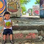 Facial Expression, Wall, Head, Art, Graffiti, Street Art, Mural, Child, Tree, Visual Arts, Smile, Adaptation, Painting, Vacation, Plant, Street, Artwork, Person