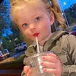 Hairstyle, Drinkware, Fun, People, Toddler, Drinking, Leisure, Sky, Blond, Food, Happy, Child, Brown Hair, Drink, Event, Glass, Non-alcoholic Beverage, Tree, Vacation, Person