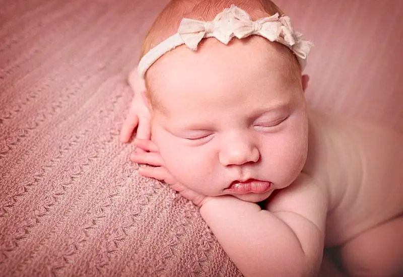 Child, Baby, Face, Photograph, Hair Accessory, Skin, Pink, Head, Cheek, Nose, Lip, Headband, Headpiece, Close-up, Mouth, Forehead, Baby Sleeping, Photography, Headgear, Toddler, Person