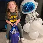 Arm, Balloon, Smile, Party Supply, Fun, Electric Blue, Personal Protective Equipment, Event, Recreation, Happy, Costume, Plastic, Toddler, Human Leg, Inflatable, Fictional Character, Sitting, Beach, Person, Joy