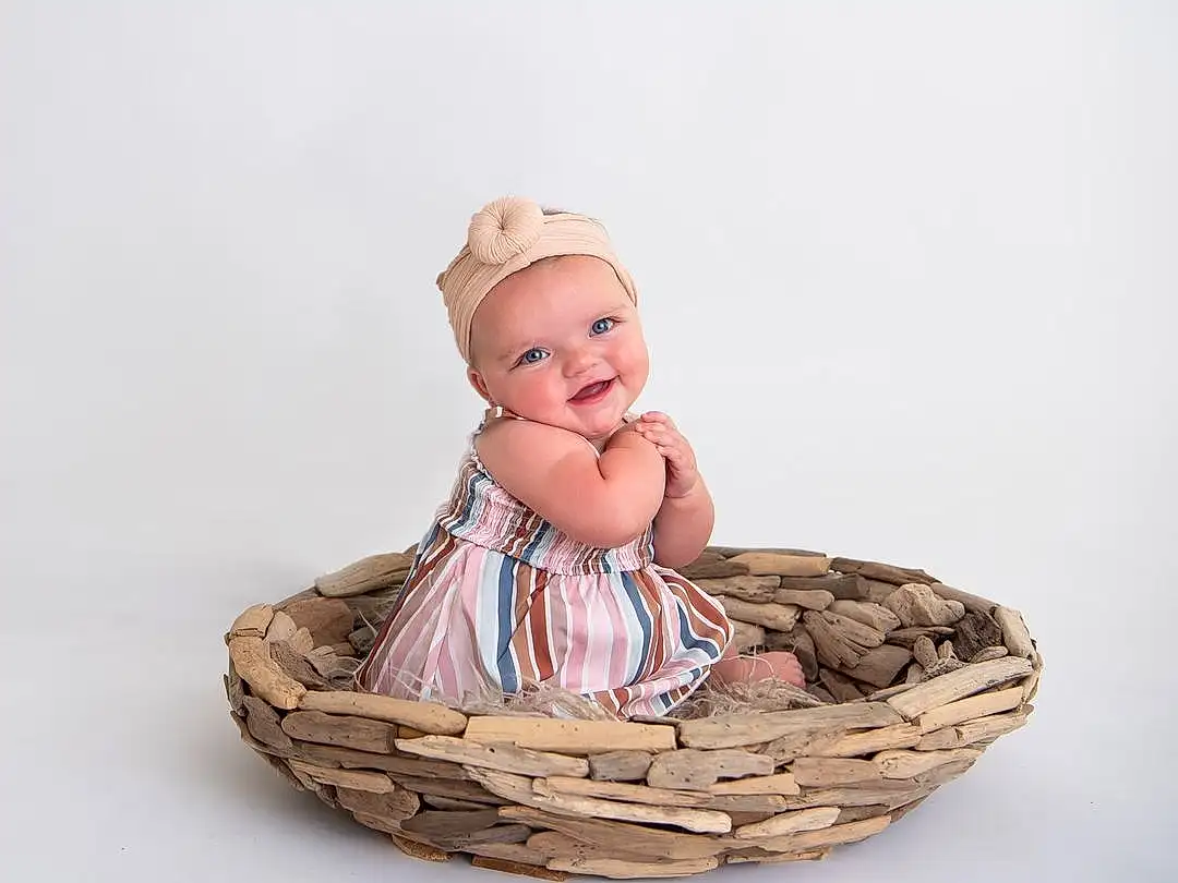 Hat, Smile, Costume Hat, Sun Hat, Storage Basket, Basket, Toy, Wood, Toddler, Baby & Toddler Clothing, Picnic Basket, Baby, Happy, Wicker, Fashion Accessory, Sitting, Bowl, Jewellery, Figurine, Home Accessories, Person