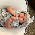 Cheek, Skin, Joint, Arm, Facial Expression, Mouth, Comfort, Human Body, Textile, Baby, Baby Sleeping, Finger, Toddler, Baby & Toddler Clothing, Hat, Child, Linens, Bedding, Bed, Person, Headwear