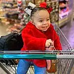 Smile, Happy, Red, Leisure, Toddler, Recreation, Child, Electric Blue, Magenta, Event, Fun, Travel, Shopping Cart, Sitting, City, Baby, Hoodie, Costume, Winter, Portrait Photography, Person