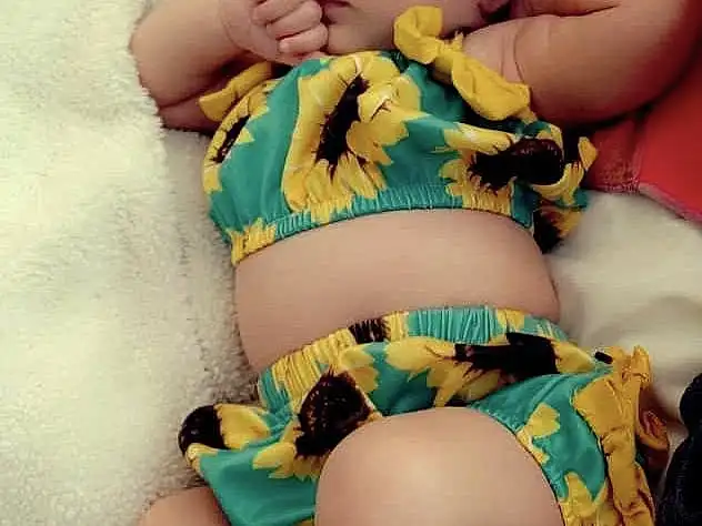 Skin, Arm, Facial Expression, Green, Mouth, Leg, Blue, Comfort, Human Body, Textile, Yellow, Baby & Toddler Clothing, Happy, Thigh, Pink, Finger, Baby, Aqua, Trunk, Nail