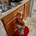 Kitchen Sink, Sink, Photograph, Cabinetry, Smile, White, Countertop, Tap, Wood, Plumbing Fixture, Kitchen, Hardwood, Toddler, Wood Stain, Varnish, Room, Baby & Toddler Clothing, Person, Joy