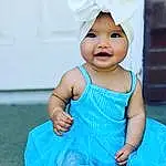 Face, Skin, Eyes, Cap, White, Smile, Blue, Azure, Purple, Sleeve, Baby & Toddler Clothing, Standing, Happy, Gesture, Pink, Baby, Finger, Aqua, Toddler, Child, Person, Headwear