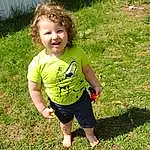 Smile, People In Nature, Baby & Toddler Clothing, Grass, Happy, Plant, Groundcover, Toddler, Grassland, Meadow, T-shirt, Lawn, Fun, Soil, Leisure, Recreation, Garden, Child, Sitting, Person, Joy