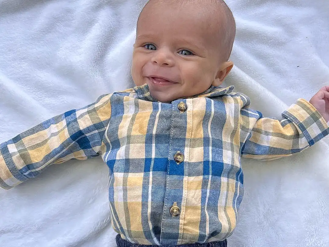 Clothing, Face, Jeans, Skin, Outerwear, Smile, Tartan, Dress Shirt, Baby & Toddler Clothing, Textile, Sleeve, Collar, Plaid, Baby, Toddler, Child, Pattern, Electric Blue, Denim, Person