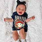 Head, Eyes, Smile, Baby & Toddler Clothing, Sleeve, Happy, T-shirt, Thigh, Toddler, Pattern, Fun, Human Leg, Child, Sportswear, Knee, Fashion Design, Sitting, Costume Hat, Top, Costume Accessory, Person