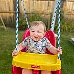 Skin, Smile, Hand, Photograph, Facial Expression, White, Shorts, Human Body, Happy, Baby & Toddler Clothing, Swing, Grass, Leisure, Toddler, Public Space, T-shirt, Playground, Red, Baby, Summer, Person