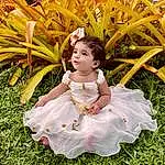 Eyes, Plant, People In Nature, Dress, Smile, Baby & Toddler Clothing, Happy, Grass, Terrestrial Plant, Toddler, Baby, Fun, Leisure, Ruffle, Day Dress, Sitting, Garden, Petal, Chair, Person