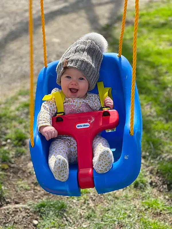Jeans, Photograph, Eyes, Facial Expression, White, Baby & Toddler Clothing, Swing, Yellow, Outdoor Recreation, Happy, People In Nature, Baby, Playground, Grass, Toddler, Leisure, Recreation, Tree, Summer, Smile, Person, Headwear