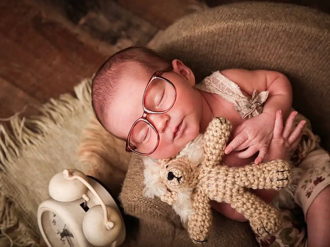 Glasses, Skin, Hand, Comfort, Flash Photography, Nail, Fawn, Baby, Wood, Thumb, Sunglasses, Eyewear, Baby & Toddler Clothing, Wrist, Happy, Jewellery, Child, Human Leg, Fashion Accessory, Toy, Person