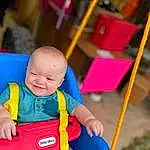 Smile, Baby Playing With Toys, Yellow, Baby, Happy, Toddler, Leisure, Red, Fun, Recreation, Toy, Child, Play, Electric Blue, Event, Baby Products, Baby & Toddler Clothing, Sitting, Toy Vehicle, Outdoor Play Equipment, Person, Joy