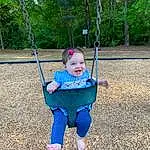 Plant, Nature, Leaf, People In Nature, Smile, Grass, Tree, Swing, Baby & Toddler Clothing, Playground, Public Space, Toddler, Woody Plant, Leisure, Baby, Electric Blue, Recreation, Fun, Outdoor Play Equipment, City, Person, Joy
